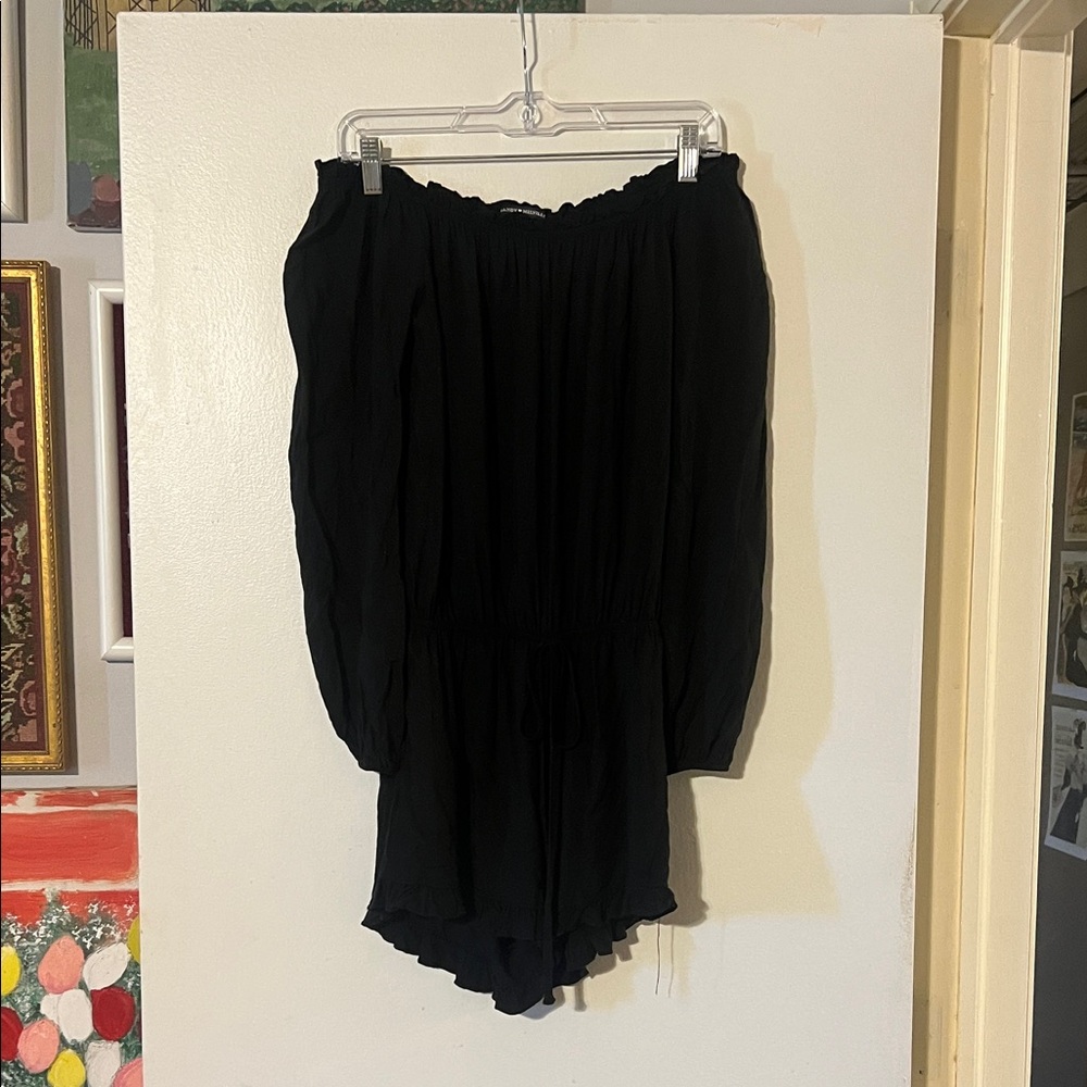 Brandy Melville black off shoulder elastic waist romper. Ruffle hem & neckline